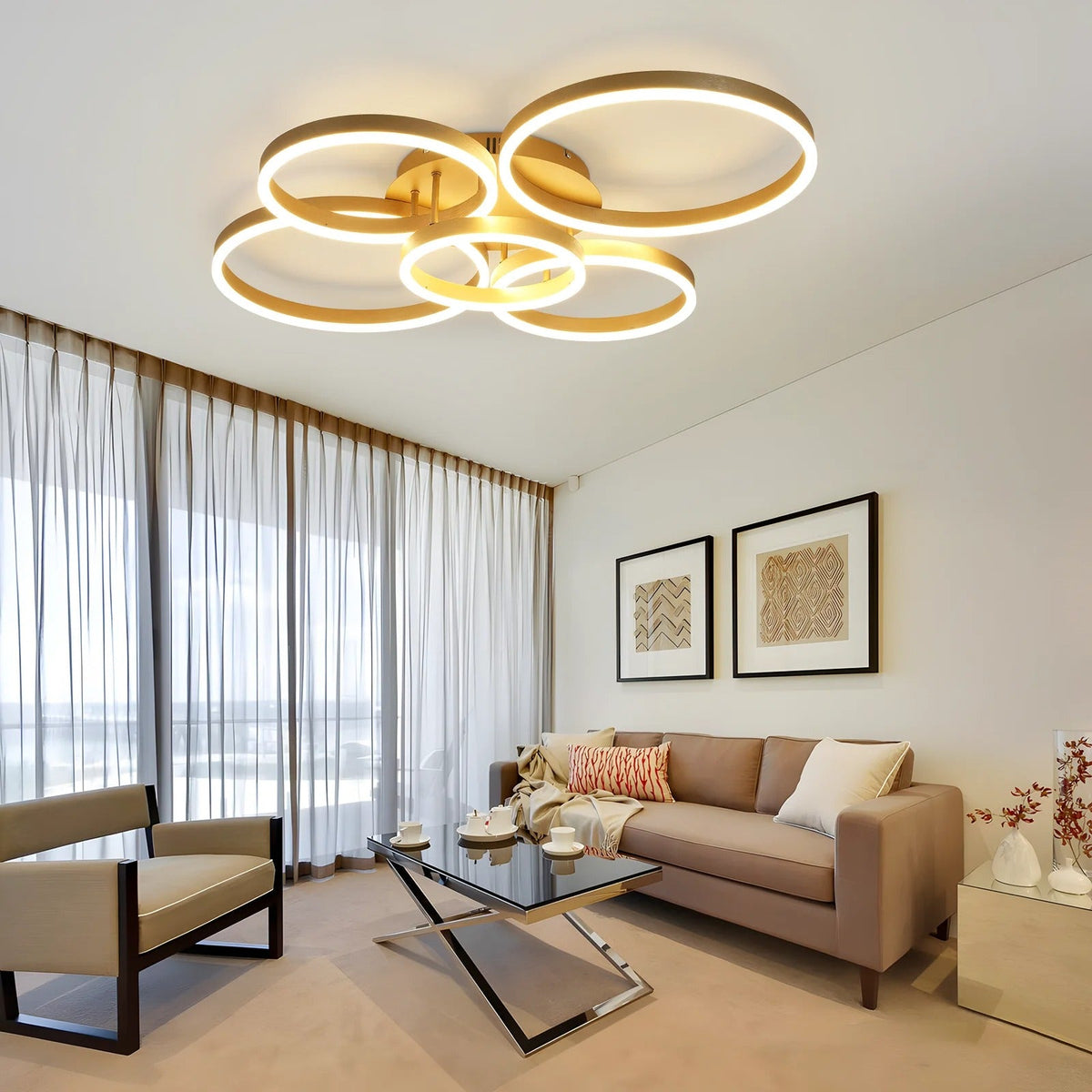 Circle gold LED ring flush ceiling light glowing warm white over a modern living room