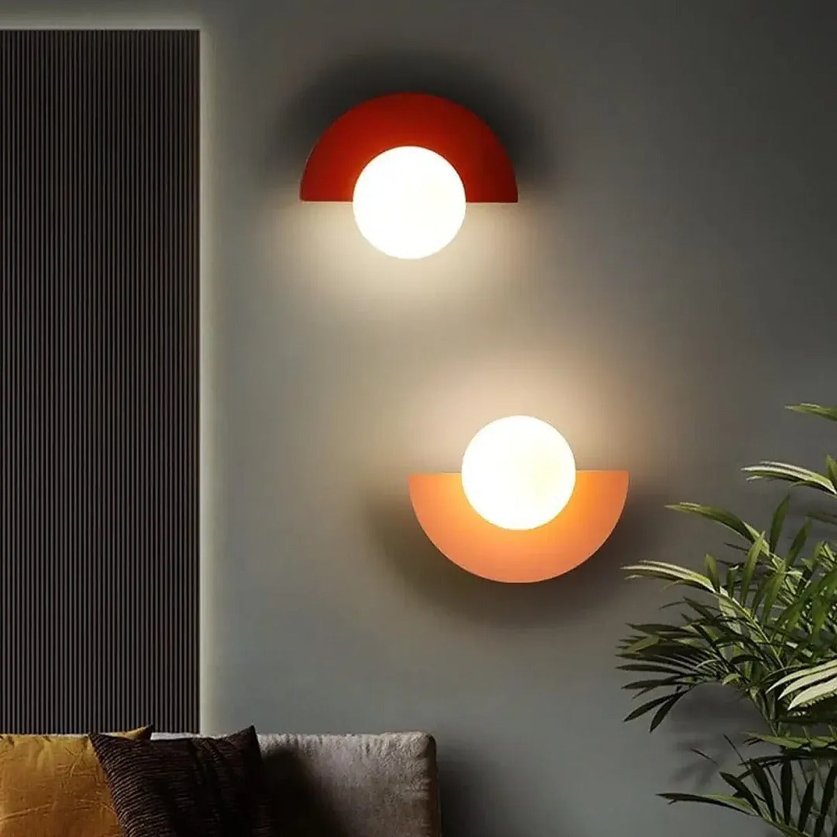 Cleo semicircle wall lights in red and orange in a living room