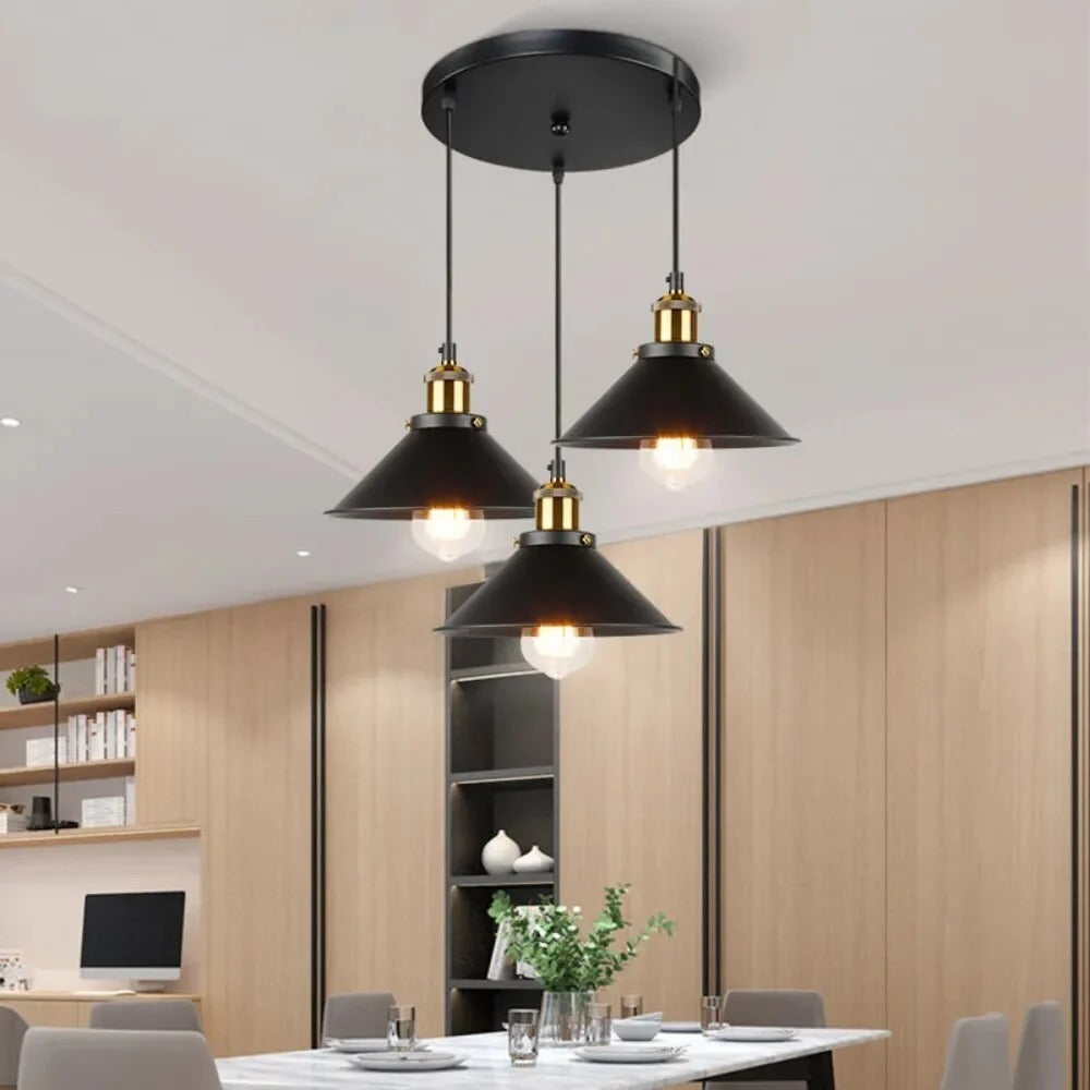 Black cone 3-light cluster pendant above a marble dining table