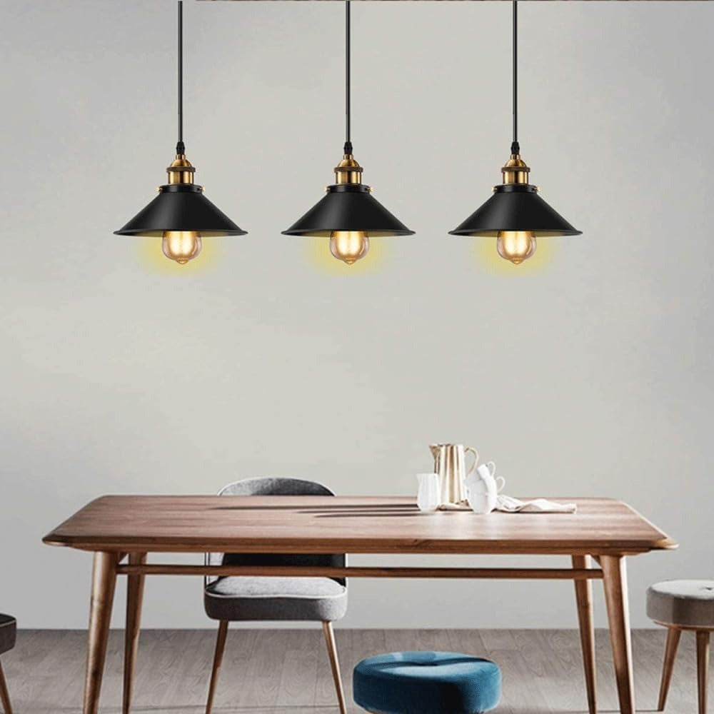 Set of 3 black cone pendants above a timber dining table