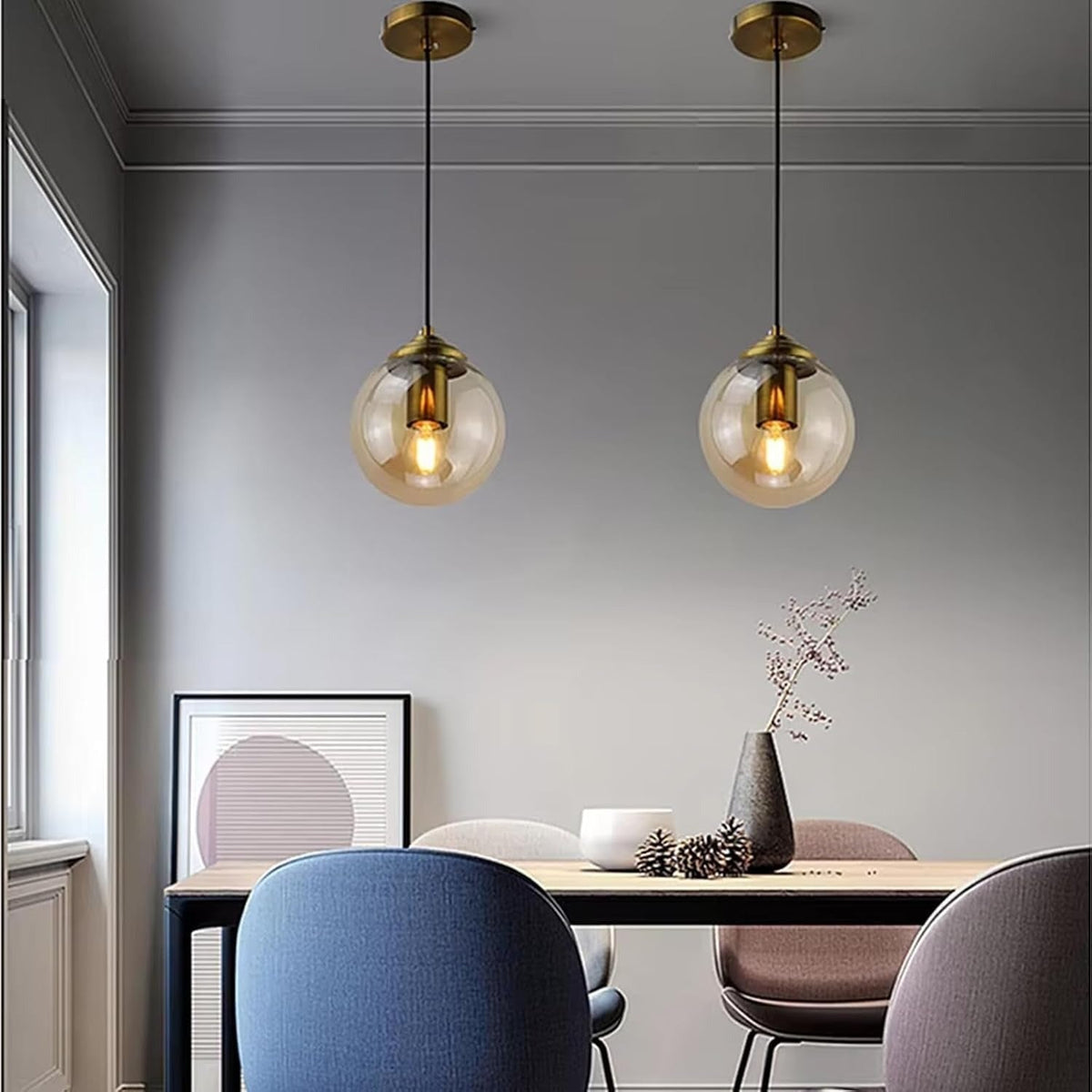 Isla amber glass globe pendant lights over a dining table