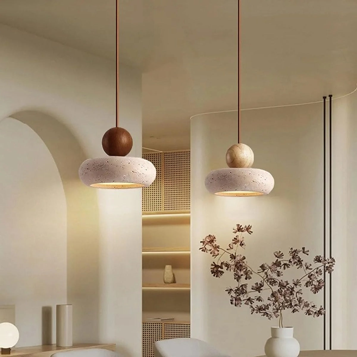 Orin travertine pendant lights in walnut and light wood side by side
