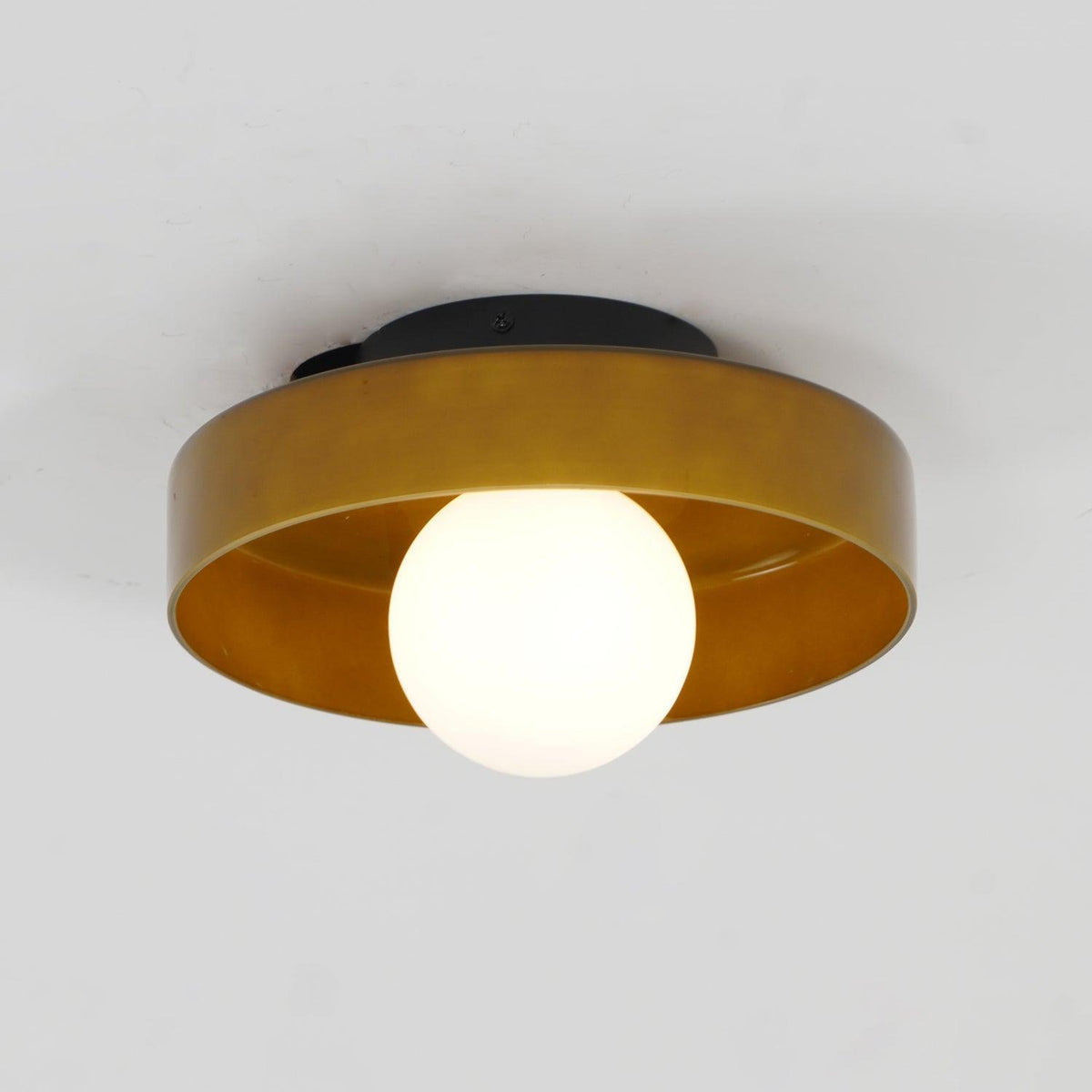 Orla glass flush ceiling light in a room