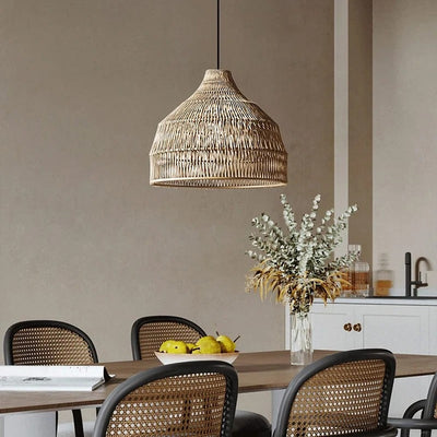 Dune woven rattan bell pendant light over a timber dining table