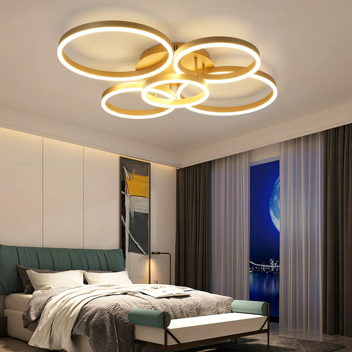 Circle 6-ring gold LED ceiling light above a bed