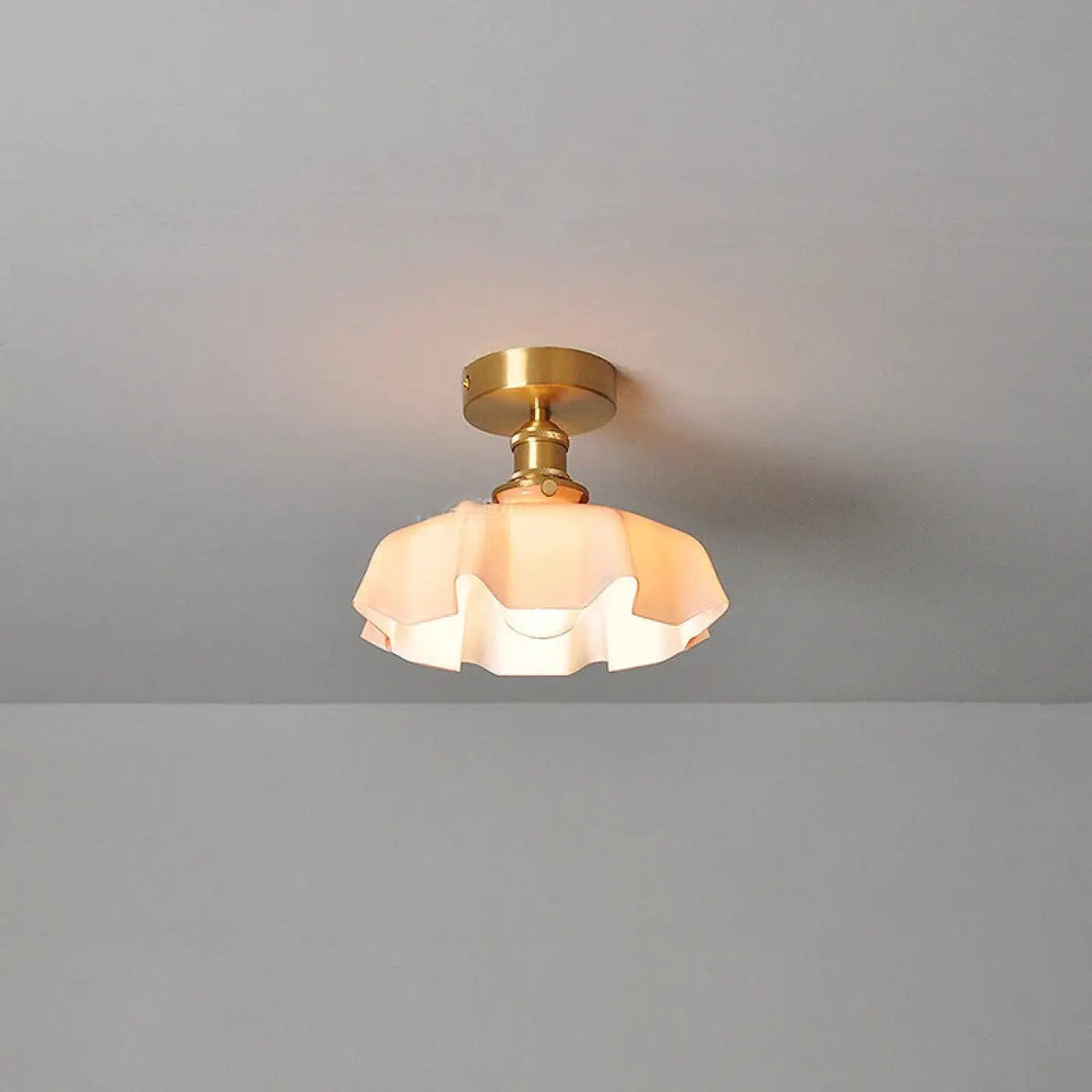 Fleur scalloped glass semi-flush ceiling light in pink with brass-finish mount