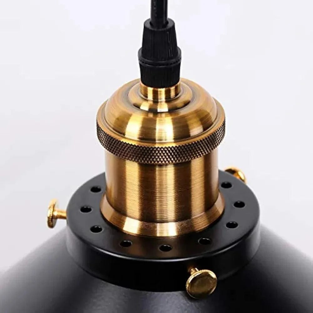 Close-up of the brass-finish lampholder on the black cone shade