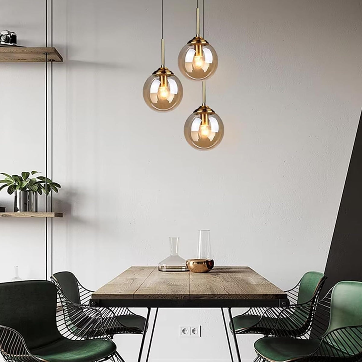 Set of 3 Isla amber globe pendants above a wooden dining table
