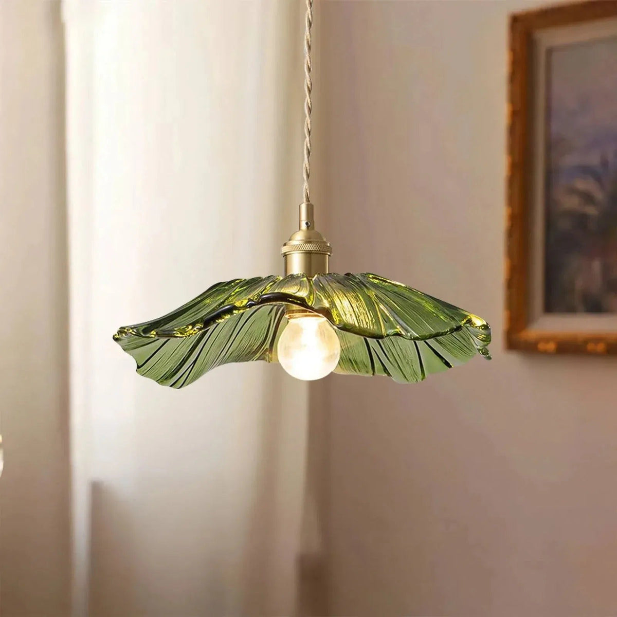 Green flower glass pendant light switched on