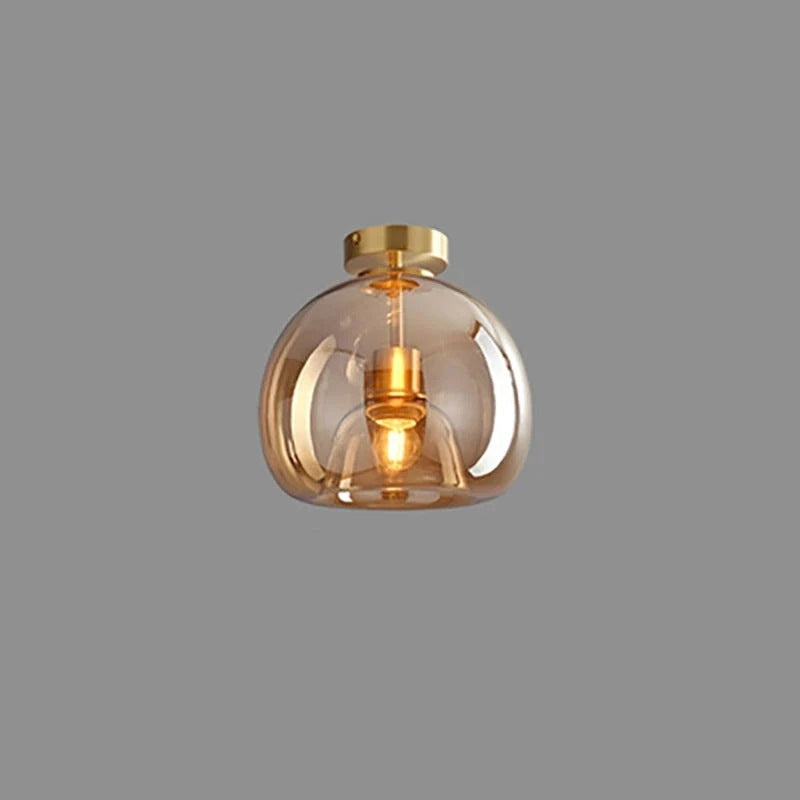 Nordic amber glass flush ceiling light with gold fittings