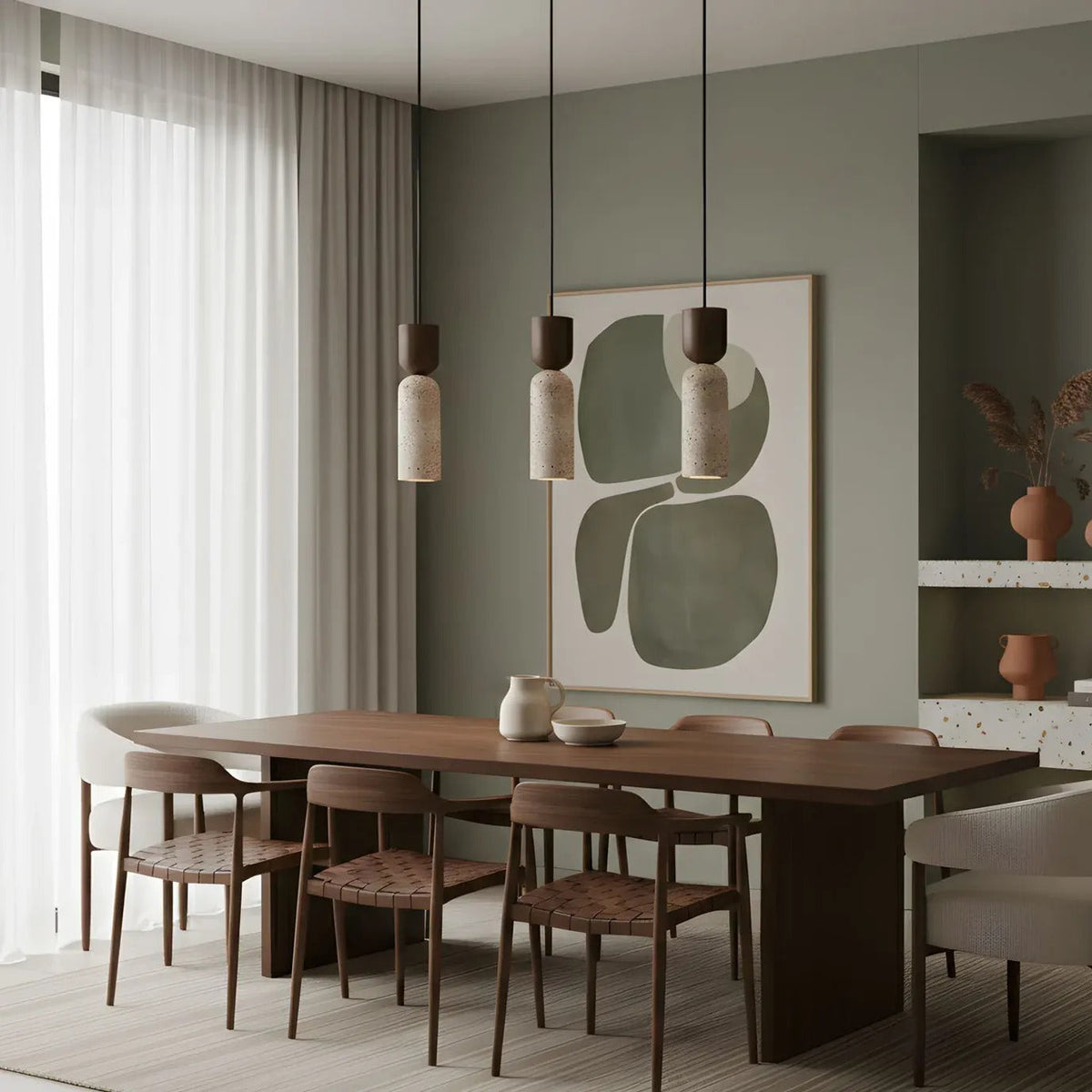 Three Pia travertine and walnut mini pendant lights over a dining table