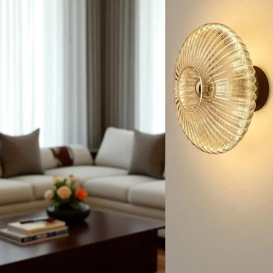 Solene amber wall light beside a bed