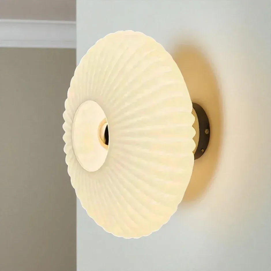Solene amber ribbed glass wall light in a living room