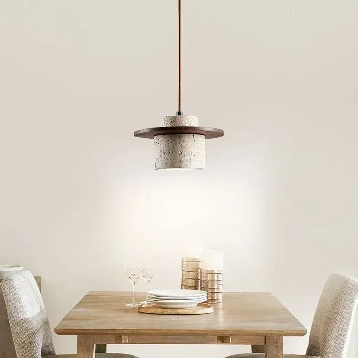 Stonova travertine and walnut pendant light above a dining table